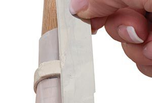 Clay being cut on a mandrel